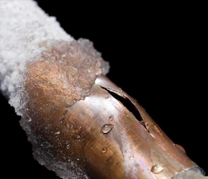A frozen pipe that has burst 